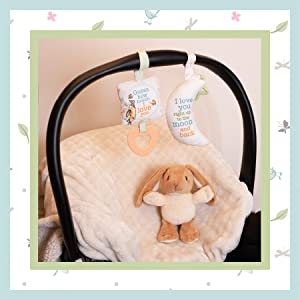 bunny plush and activity toys in crib